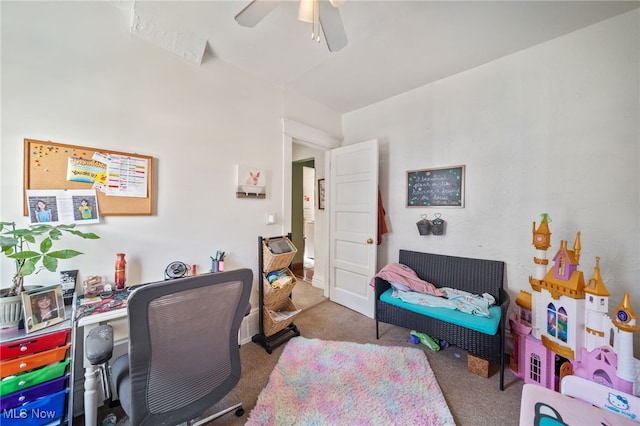 home office featuring light carpet and ceiling fan