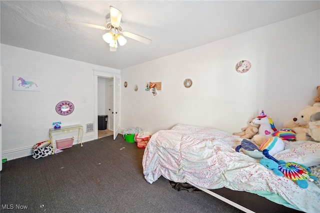 bedroom with ceiling fan and carpet