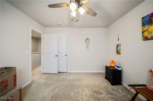 bedroom with ceiling fan and light colored carpet