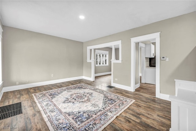 empty room featuring dark wood-type flooring