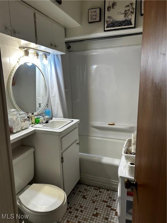 full bathroom with vanity, tile patterned floors, toilet, and bathtub / shower combination