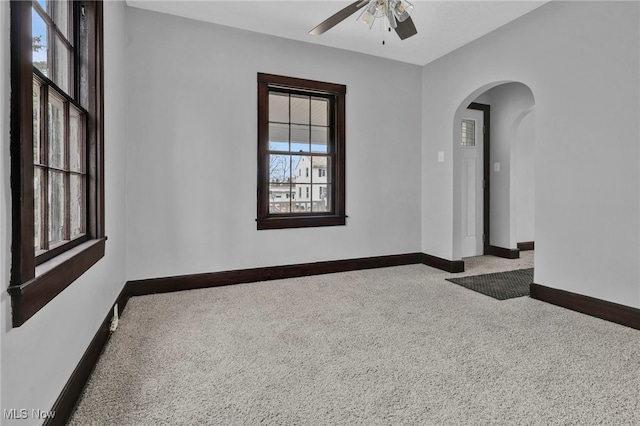 carpeted empty room with ceiling fan