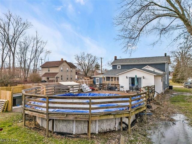 view of swimming pool featuring a wooden deck