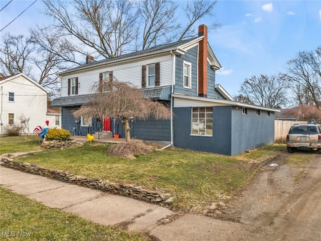 view of property with a front lawn