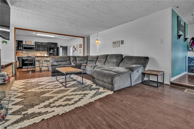 living room featuring dark hardwood / wood-style floors