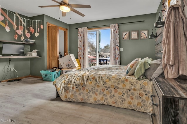 bedroom featuring ceiling fan and access to outside