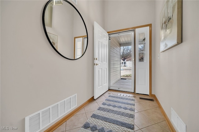 entrance foyer featuring light tile patterned floors