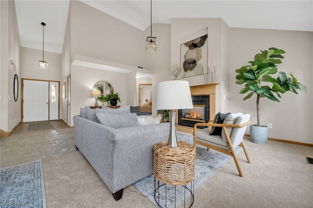 living room featuring high vaulted ceiling and carpet