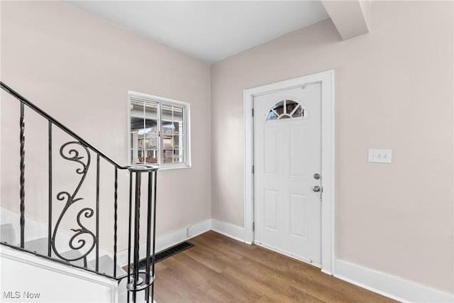 foyer with wood-type flooring