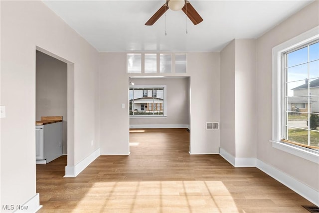 unfurnished room with ceiling fan and light hardwood / wood-style flooring