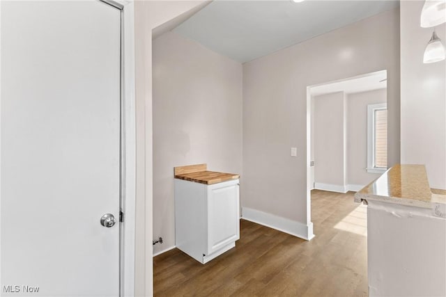 hallway featuring dark hardwood / wood-style floors