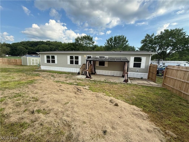 14000 Lincoln St SE, Minerva, OH 44657 - back of house featuring a shed