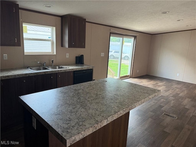 14000 Lincoln St SE, Minerva, OH 44657 - kitchen featuring a textured ceiling, wood finished floors, and black dishwasher