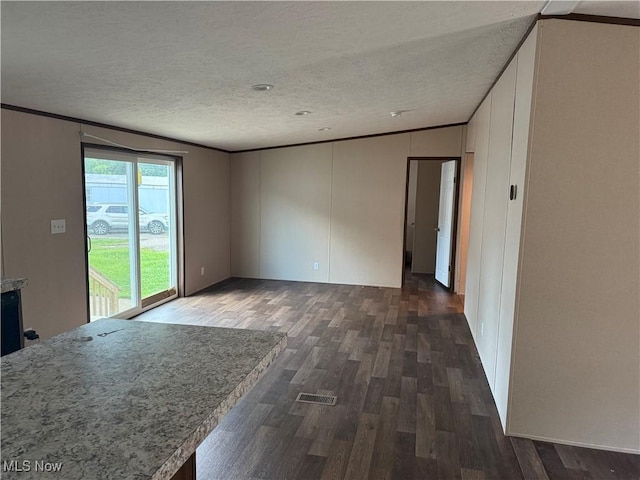 14000 Lincoln St SE, Minerva, OH 44657 - unfurnished living room featuring dark wood-type flooring, a textured ceiling, and crown molding