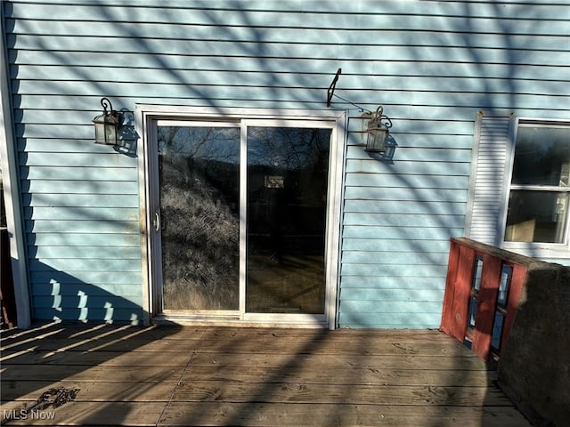 doorway to property featuring a deck