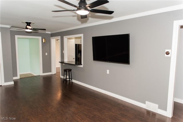 unfurnished living room with ornamental molding, ceiling fan, and dark hardwood / wood-style flooring