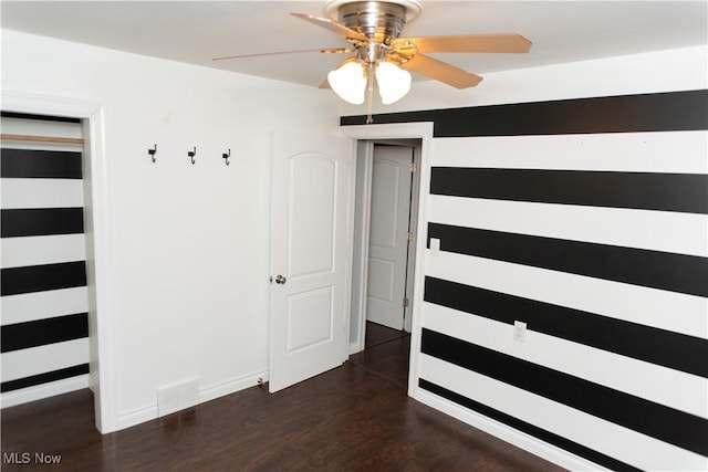 unfurnished bedroom featuring dark hardwood / wood-style floors