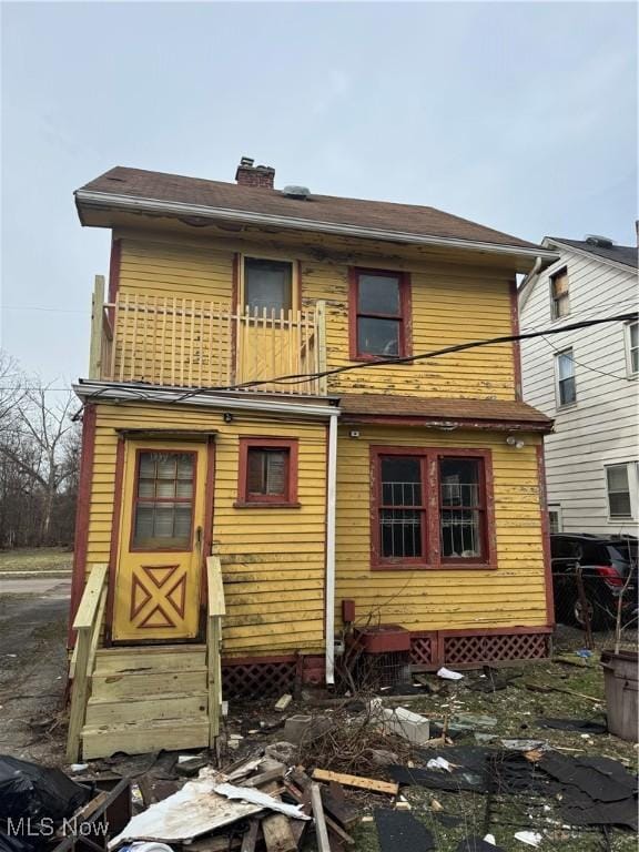 rear view of house with a balcony