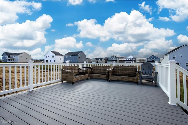 wooden terrace featuring outdoor lounge area