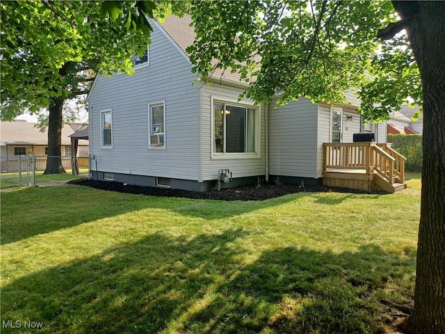 back of property with cooling unit and a yard