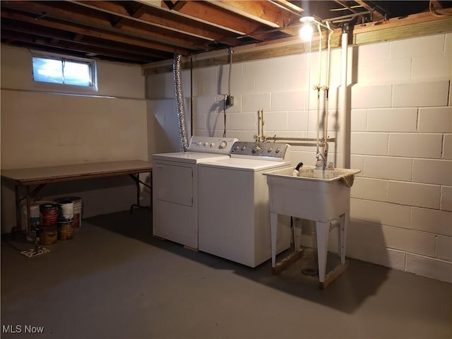 clothes washing area featuring independent washer and dryer