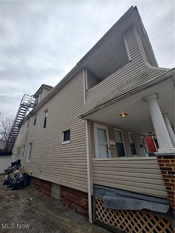 view of property exterior with a porch