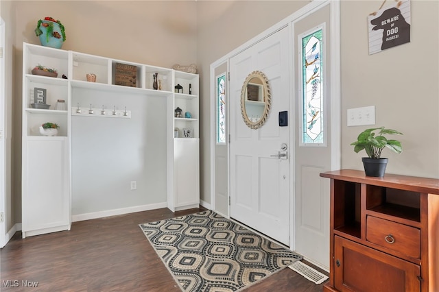 foyer with dark hardwood / wood-style flooring