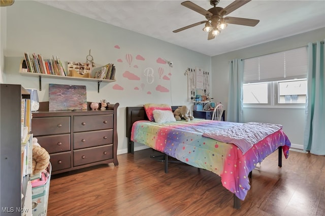 bedroom with ceiling fan and hardwood / wood-style floors