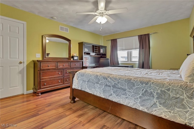 bedroom with hardwood / wood-style flooring and ceiling fan