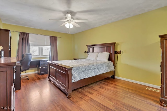 bedroom featuring hardwood / wood-style flooring and ceiling fan