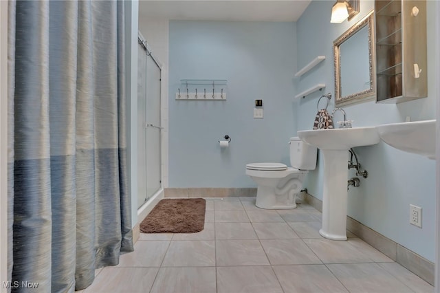 bathroom featuring walk in shower, toilet, and tile patterned flooring