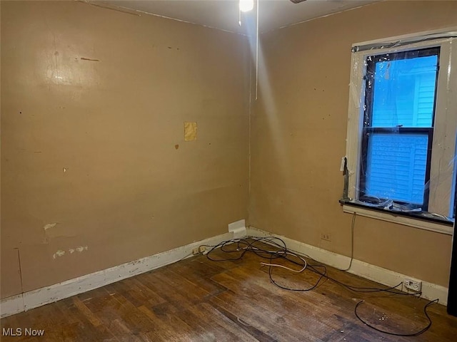 spare room featuring hardwood / wood-style flooring