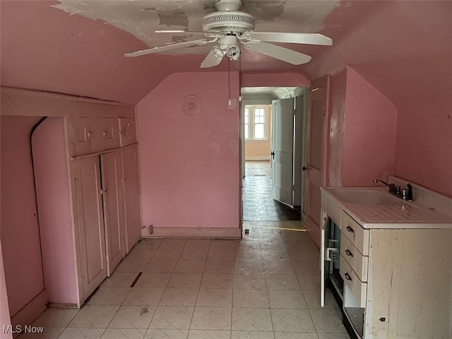 bonus room featuring lofted ceiling, sink, and ceiling fan