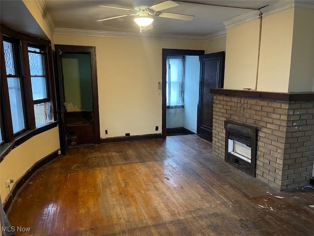 unfurnished living room with a brick fireplace, ornamental molding, dark hardwood / wood-style floors, and ceiling fan