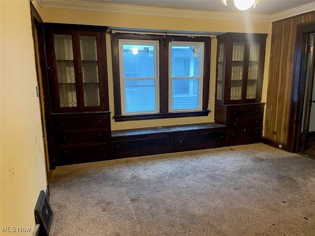 carpeted empty room with crown molding