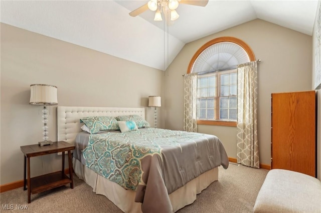 carpeted bedroom with lofted ceiling and ceiling fan