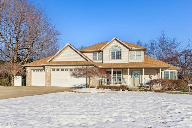 view of front of home featuring a garage and covered porch