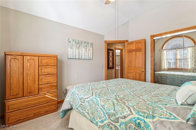 carpeted bedroom with lofted ceiling and ceiling fan