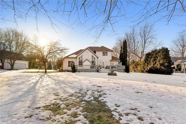 front of property featuring a garage and a deck