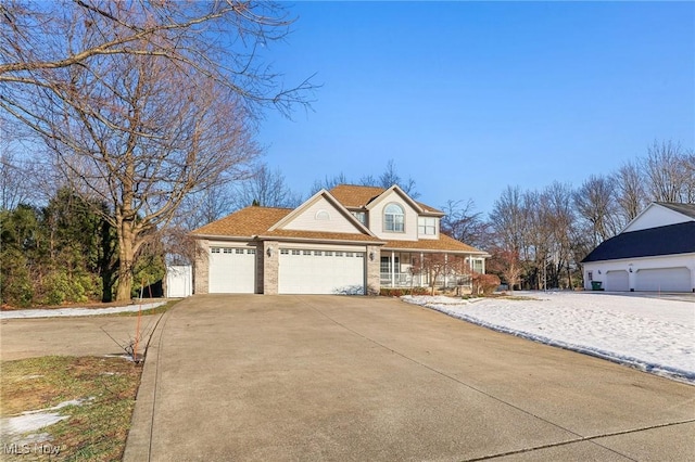 view of front of house featuring a garage and covered porch