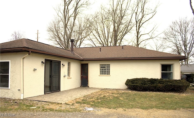 back of property with a patio area