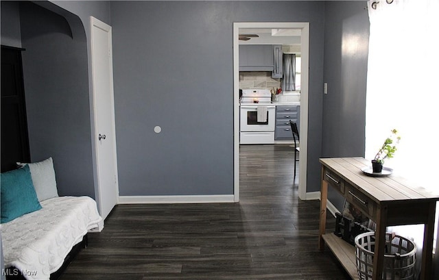 corridor with dark hardwood / wood-style floors