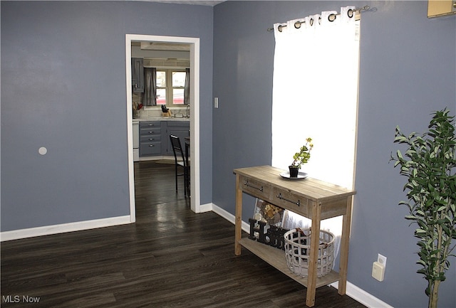 hall with dark wood-type flooring