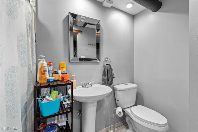 bathroom with sink and toilet