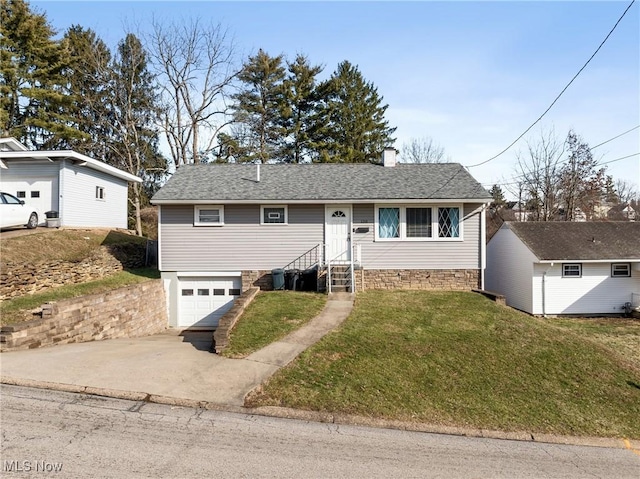 view of front of home with a garage and a front yard