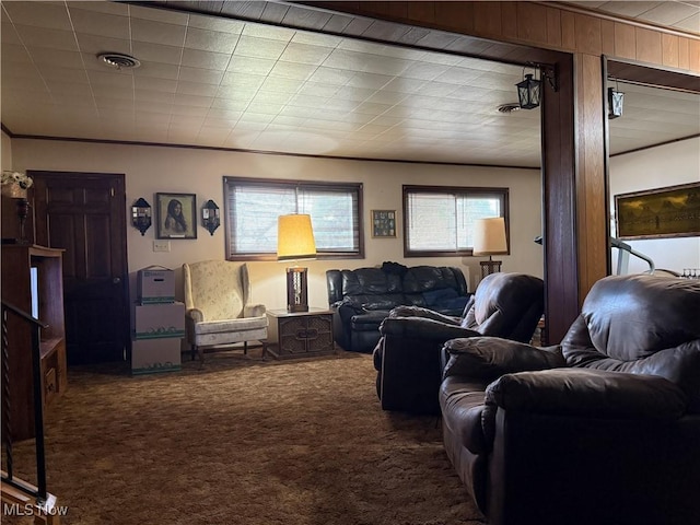 carpeted living room featuring ornamental molding