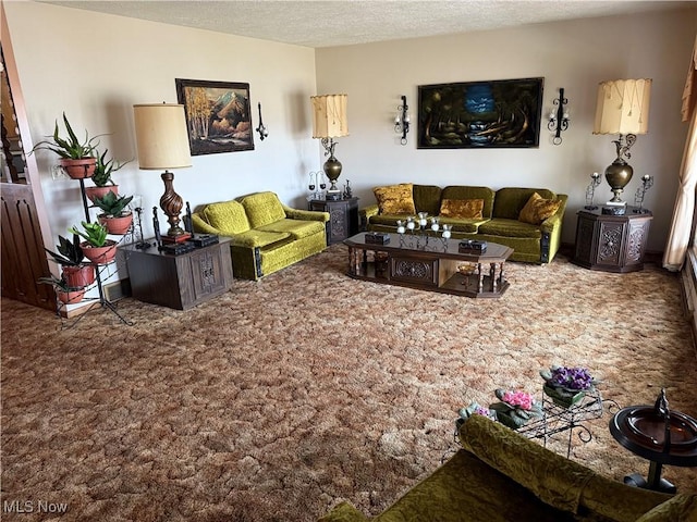 living room featuring carpet flooring and a textured ceiling