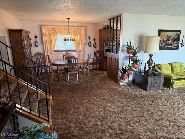 dining area featuring a chandelier, a textured ceiling, and dark carpet