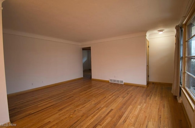 unfurnished room featuring light hardwood / wood-style flooring