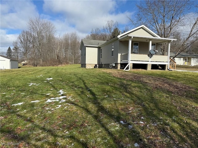 view of property exterior with a yard and covered porch